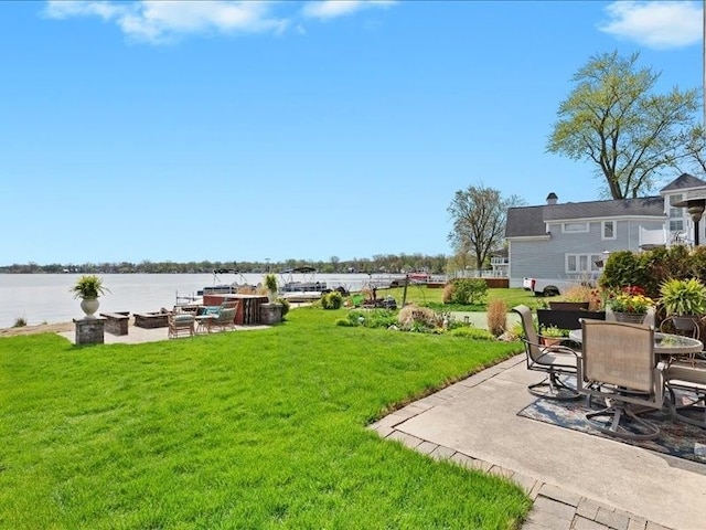 2011 W Lake Dr, Novi, MI 48377 - view of grassy yard with a patio area and a water view