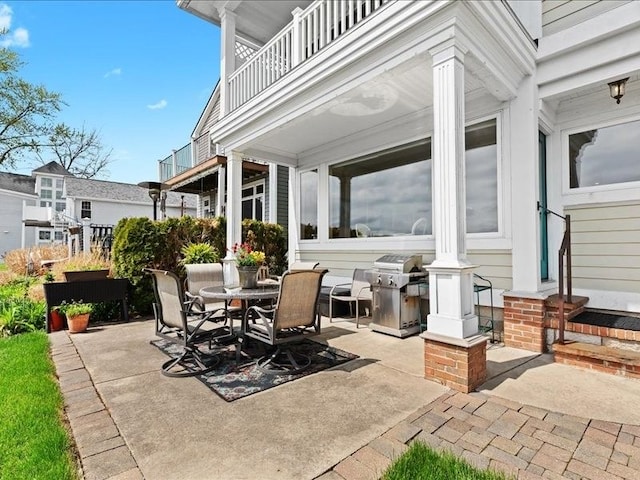 2011 W Lake Dr, Novi, MI 48377 - view of patio with area for grilling, outdoor dining space, and a balcony