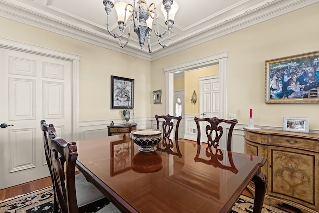 2011 W Lake Dr, Novi, MI 48377 - dining space with a chandelier, a decorative wall, wainscoting, ornamental molding, and wood finished floors