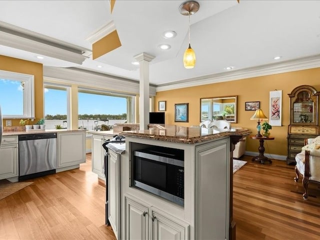 2011 W Lake Dr, Novi, MI 48377 - kitchen featuring stainless steel appliances, healthy amount of natural light, light wood-style flooring, decorative columns, and ornamental molding