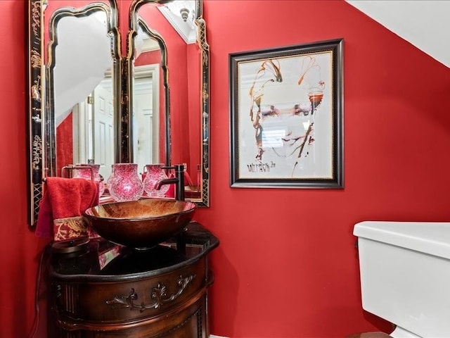 2011 W Lake Dr, Novi, MI 48377 - bathroom featuring vanity, toilet, and lofted ceiling