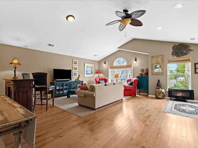 2011 W Lake Dr, Novi, MI 48377 - living area featuring a ceiling fan, healthy amount of natural light, vaulted ceiling, light wood-style flooring, and recessed lighting