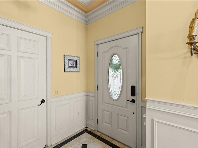 2011 W Lake Dr, Novi, MI 48377 - tiled foyer entrance featuring inlaid floor details, ornamental molding, and wainscoting
