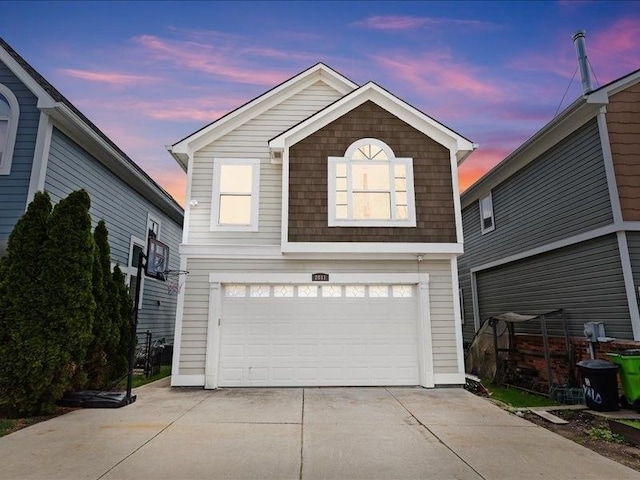 2011 W Lake Dr, Novi, MI 48377 - traditional-style house featuring an attached garage and driveway