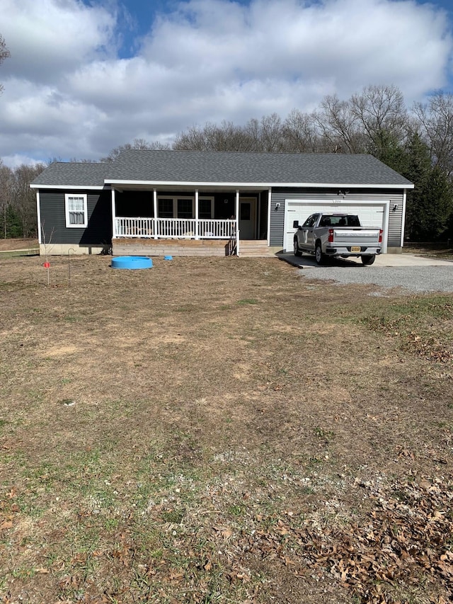 single story home with roof with shingles, covered porch, a garage, and driveway