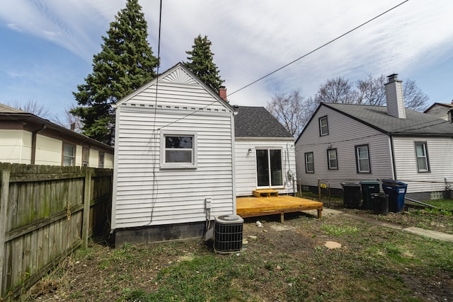 881 Garfield Ave, Lincoln Park, MI 48146 - back of house featuring a deck, fence, and central AC unit