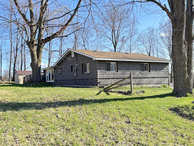 view of side of property featuring a yard
