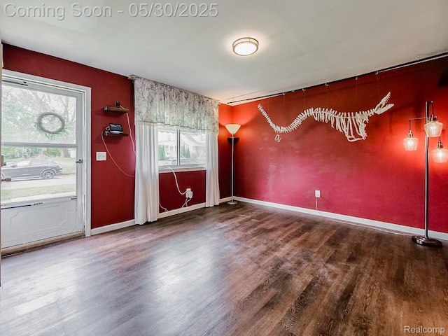 45 E George Ave, Hazel Park, MI 48030 - empty room featuring plenty of natural light, wood finished floors, baseboards, and an accent wall
