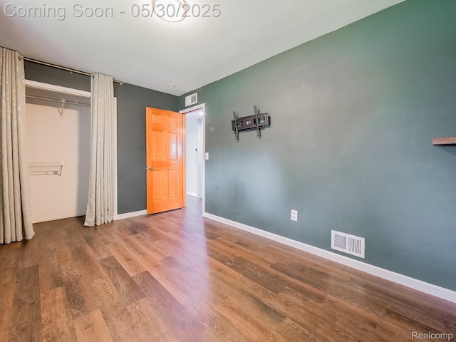 45 E George Ave, Hazel Park, MI 48030 - unfurnished bedroom with wood finished floors, a closet, and baseboards