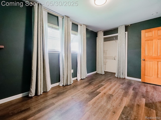 45 E George Ave, Hazel Park, MI 48030 - unfurnished bedroom featuring wood finished floors and baseboards