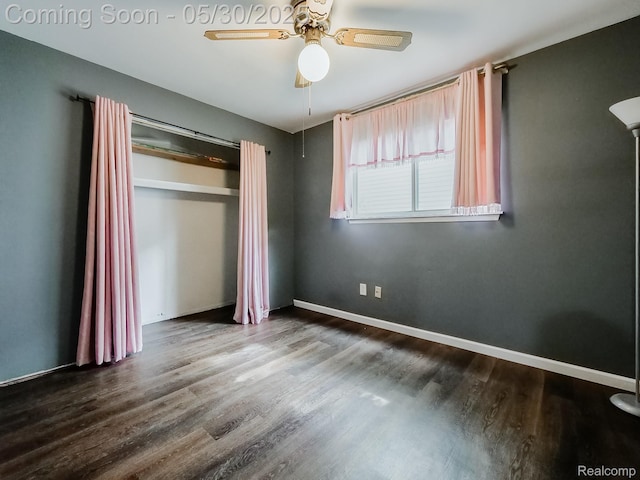 45 E George Ave, Hazel Park, MI 48030 - unfurnished bedroom featuring dark wood-style floors, ceiling fan, baseboards, and a closet