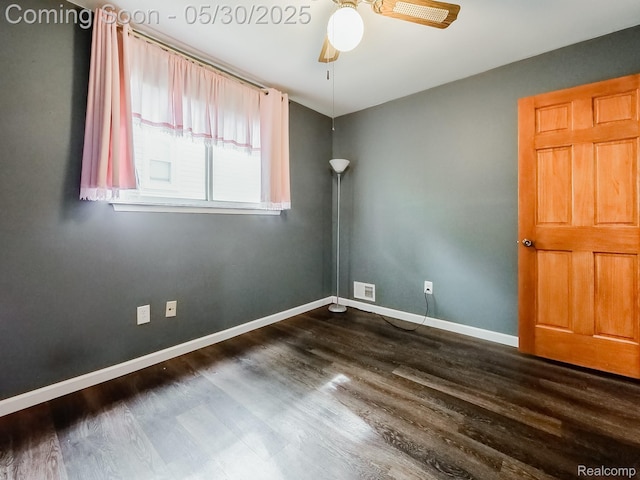 45 E George Ave, Hazel Park, MI 48030 - empty room featuring a ceiling fan, dark wood-style floors, and baseboards
