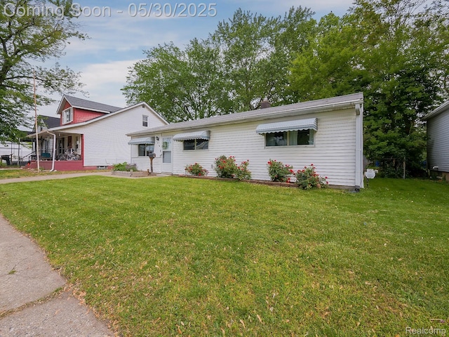 45 E George Ave, Hazel Park, MI 48030 - view of front of property with a front yard and a porch