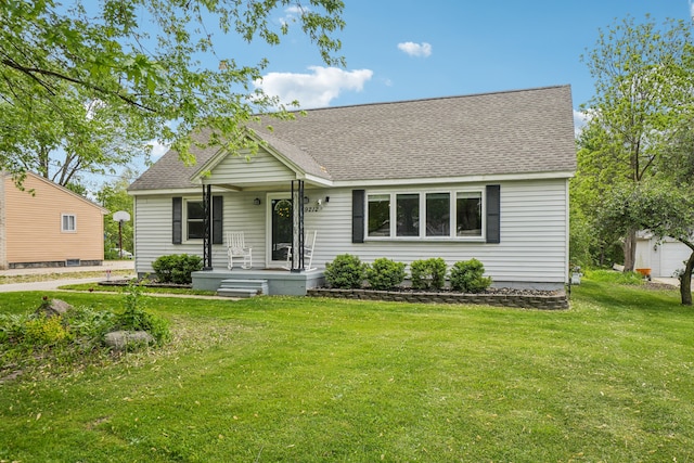 49212 Fuller Rd, Chesterfield, MI 48051 - view of front of home with a shingled roof and a front yard