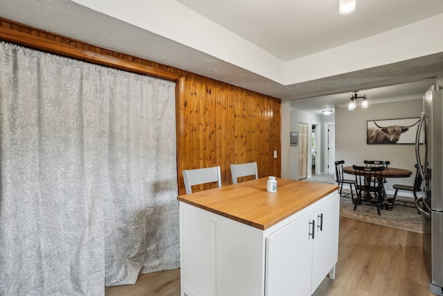 49212 Fuller Rd, Chesterfield, MI 48051 - kitchen with wood counters, white cabinets, freestanding refrigerator, and light wood finished floors