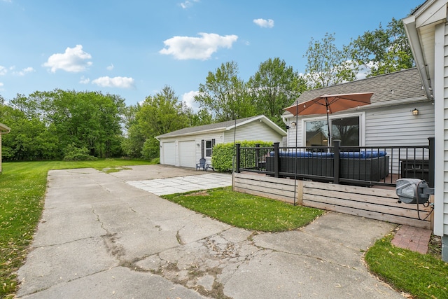 49212 Fuller Rd, Chesterfield, MI 48051 - view of grassy yard featuring an outbuilding, a deck, and a garage