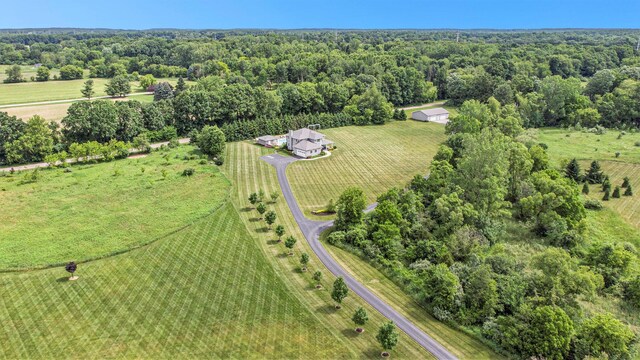 birds eye view of property featuring a rural view and a forest view