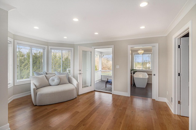 unfurnished room with light wood finished floors, ornamental molding, and recessed lighting