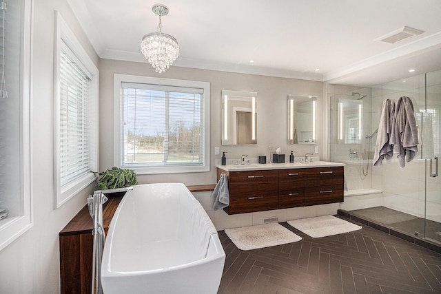 full bathroom with double vanity, a stall shower, a soaking tub, visible vents, and a sink