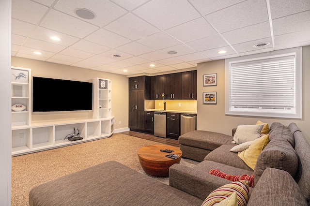 living area featuring visible vents, baseboards, recessed lighting, and wet bar