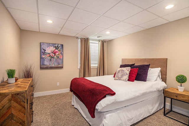 bedroom with a paneled ceiling, recessed lighting, baseboards, and carpet floors