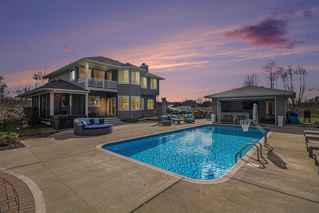 view of swimming pool with a patio area, fence, an outdoor hangout area, an outbuilding, and a fenced in pool