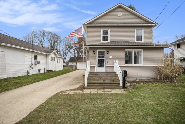 249 Wentworth Ave, Battle Creek, MI 49015 - view of front of house featuring a front yard and concrete driveway