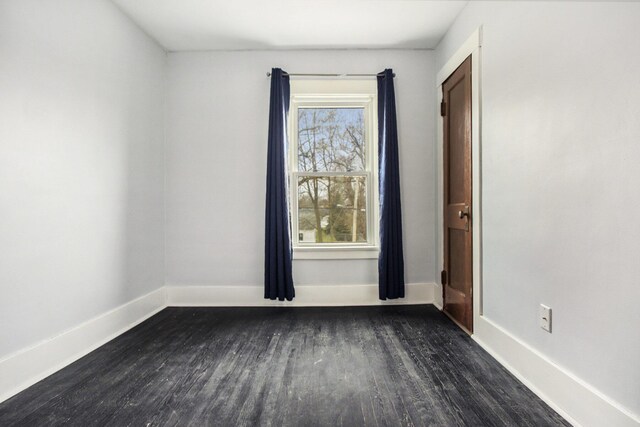 249 Wentworth Ave, Battle Creek, MI 49015 - spare room featuring baseboards and dark wood finished floors