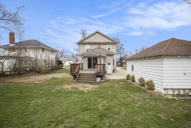 249 Wentworth Ave, Battle Creek, MI 49015 - rear view of house with a patio area, a wooden deck, and a lawn