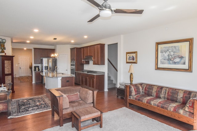 living area featuring a ceiling fan, dark wood-style flooring, stairway, and recessed lighting