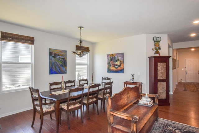 dining area featuring baseboards, a chandelier, recessed lighting, and wood finished floors
