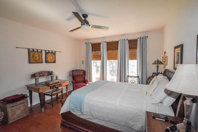 bedroom featuring baseboards, ceiling fan, and wood finished floors