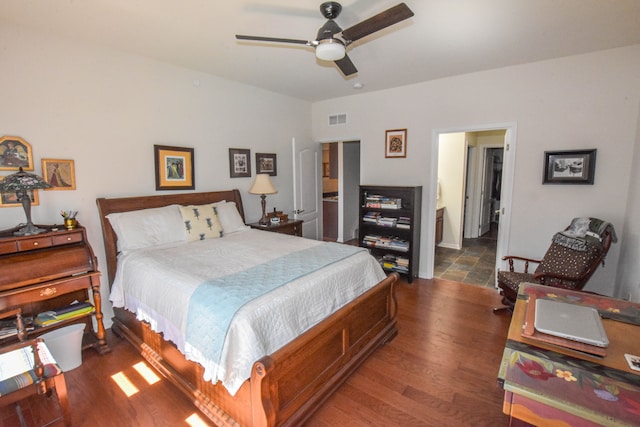 bedroom featuring ceiling fan, visible vents, and wood finished floors