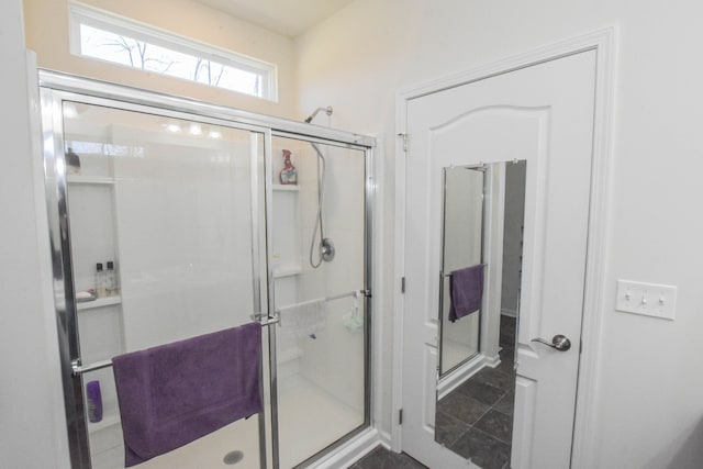 bathroom featuring a shower stall