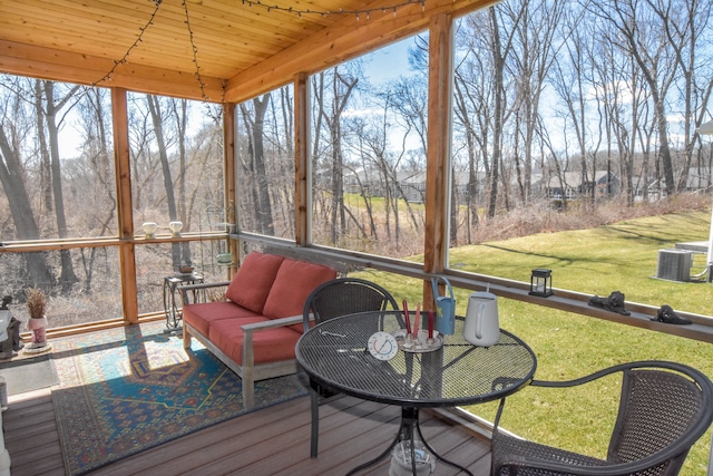 sunroom / solarium featuring an outdoor hangout area and plenty of natural light