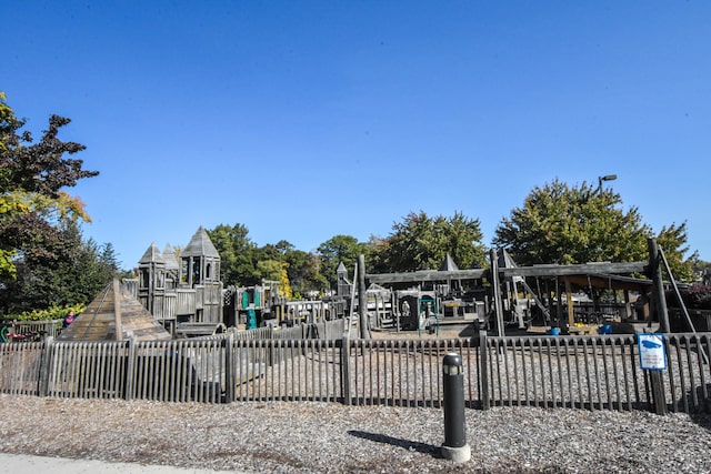 community jungle gym featuring fence