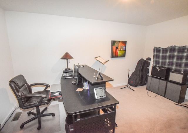 office space with visible vents, baseboards, and carpet floors