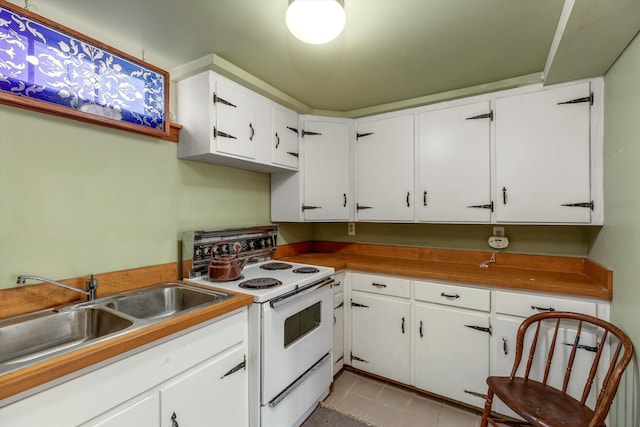 48814 Gyde Rd, Canton, MI 48187 - kitchen featuring white cabinets, white range with electric stovetop, a sink, and light tile patterned flooring