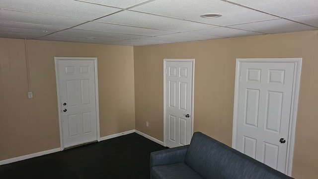 4107 N Campbell St, Detroit, MI 48210 - unfurnished room with baseboards and a paneled ceiling