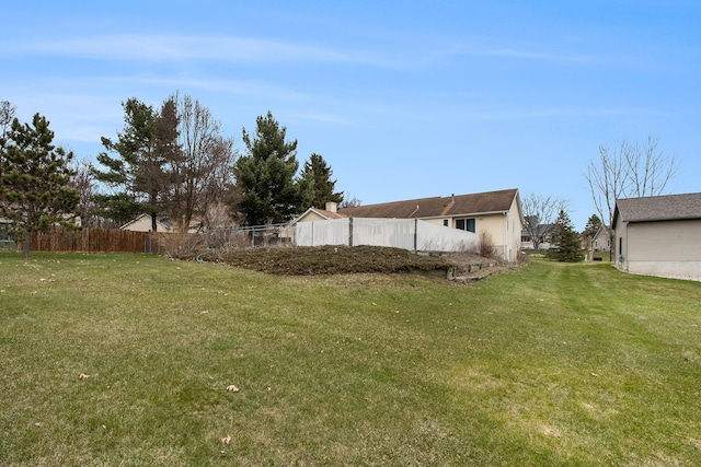 view of yard with fence
