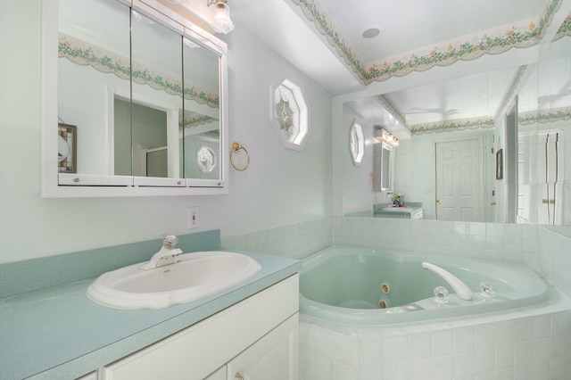 bathroom featuring a jetted tub and vanity