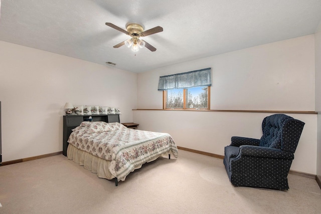 bedroom featuring a ceiling fan, baseboards, carpet, and visible vents