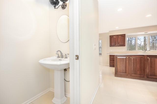 5521 Lohr Lake Dr, Ann Arbor, MI 48108 - bathroom featuring tile patterned flooring, baseboards, recessed lighting, and a sink