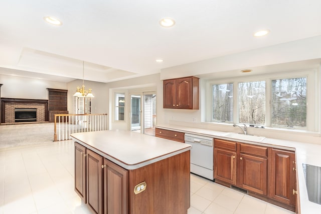 5521 Lohr Lake Dr, Ann Arbor, MI 48108 - kitchen featuring white dishwasher, a sink, light countertops, healthy amount of natural light, and recessed lighting