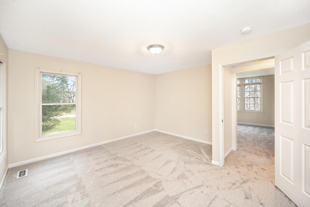 5521 Lohr Lake Dr, Ann Arbor, MI 48108 - unfurnished room with light colored carpet, baseboards, and a smoke detector