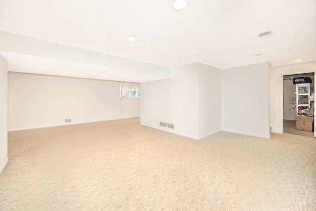 5521 Lohr Lake Dr, Ann Arbor, MI 48108 - below grade area with light carpet, recessed lighting, and baseboards