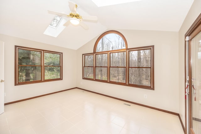 5521 Lohr Lake Dr, Ann Arbor, MI 48108 - unfurnished room with a skylight, ceiling fan, vaulted ceiling, and baseboards