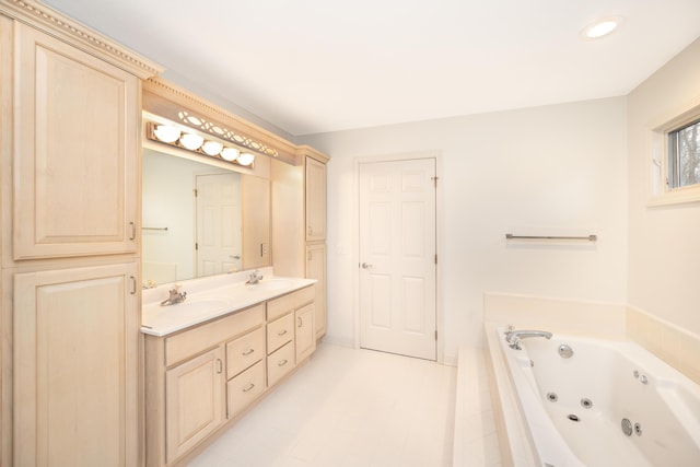 5521 Lohr Lake Dr, Ann Arbor, MI 48108 - bathroom featuring double vanity, a jetted tub, and recessed lighting