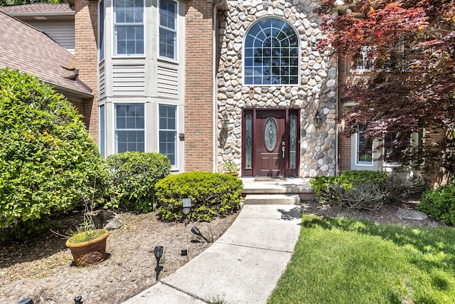 5521 Lohr Lake Dr, Ann Arbor, MI 48108 - doorway to property featuring stone siding and brick siding