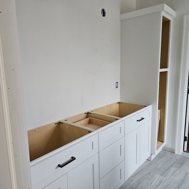 kitchen featuring white cabinets